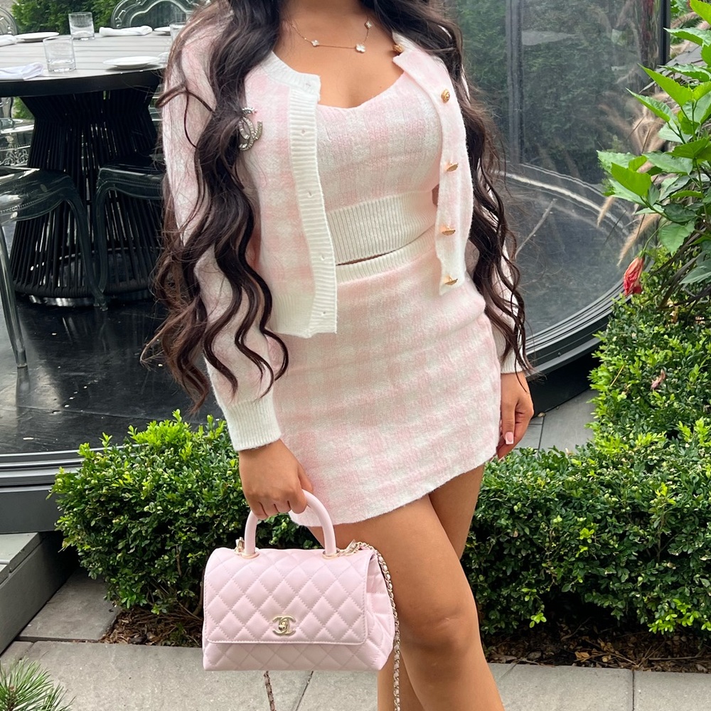 Baby pink top, skirt, and cardigan set